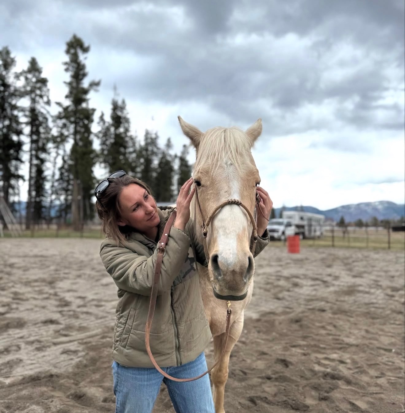 Paige Maggio performing equine chiropractic care on a horse